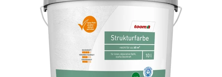 Ein Farbeimer mit grünem Deckel